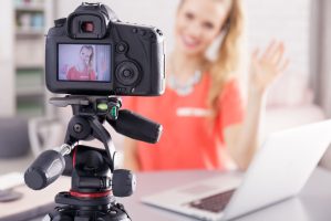 Young vlogger girl recording her new daily videoblog